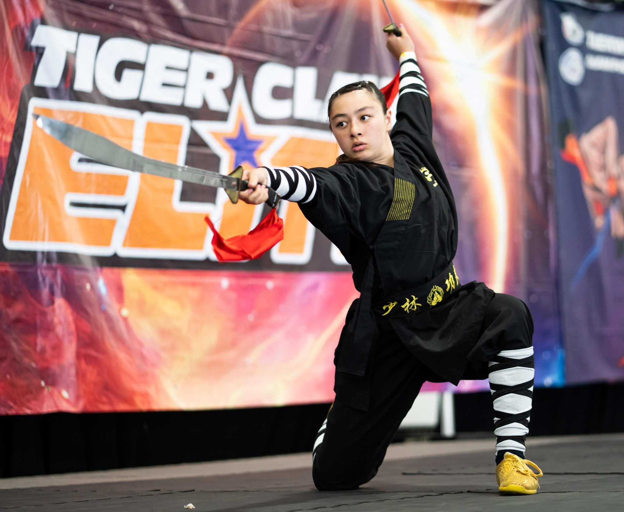 Student performing broadsword form at Tiger Claw Elite