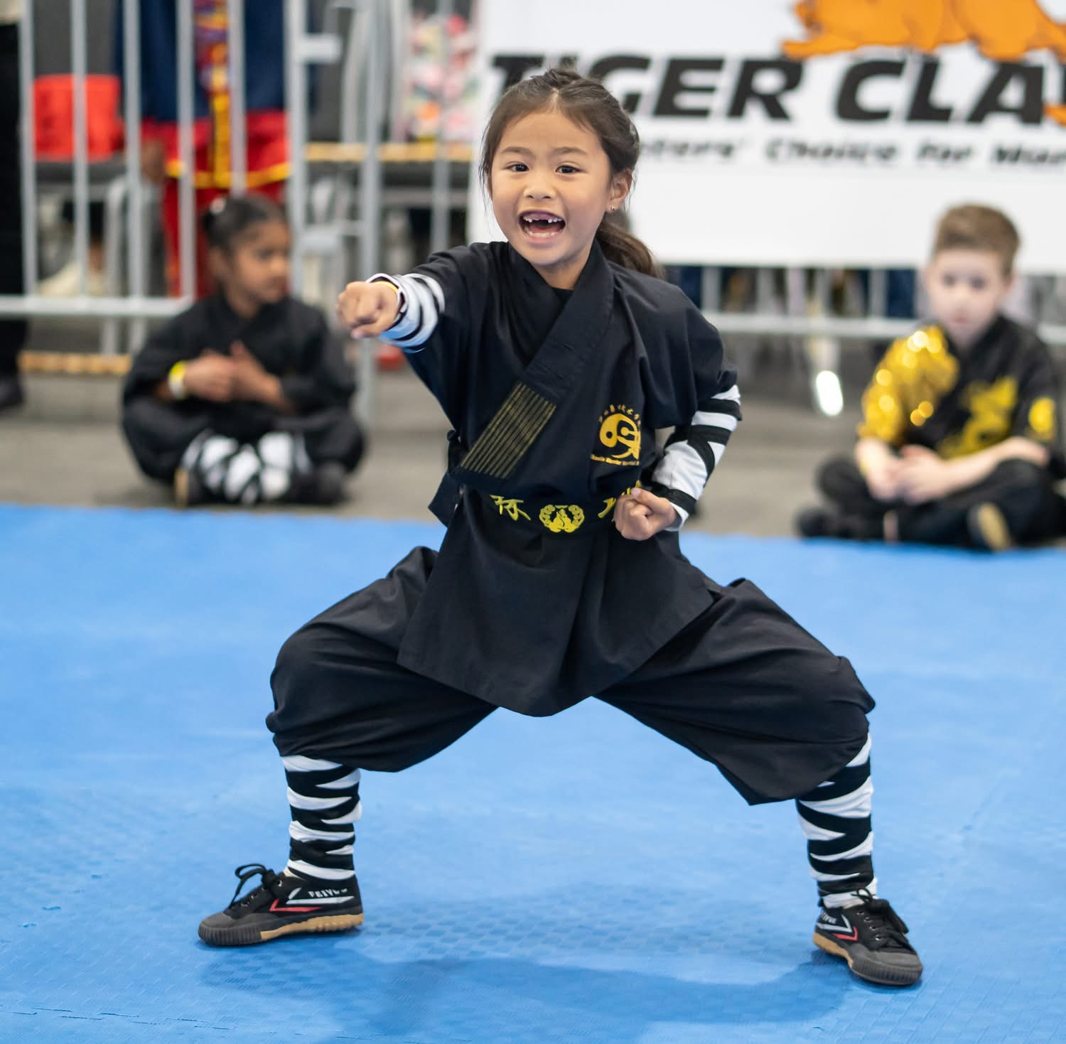 Young student competing with a smile at Tiger Claw