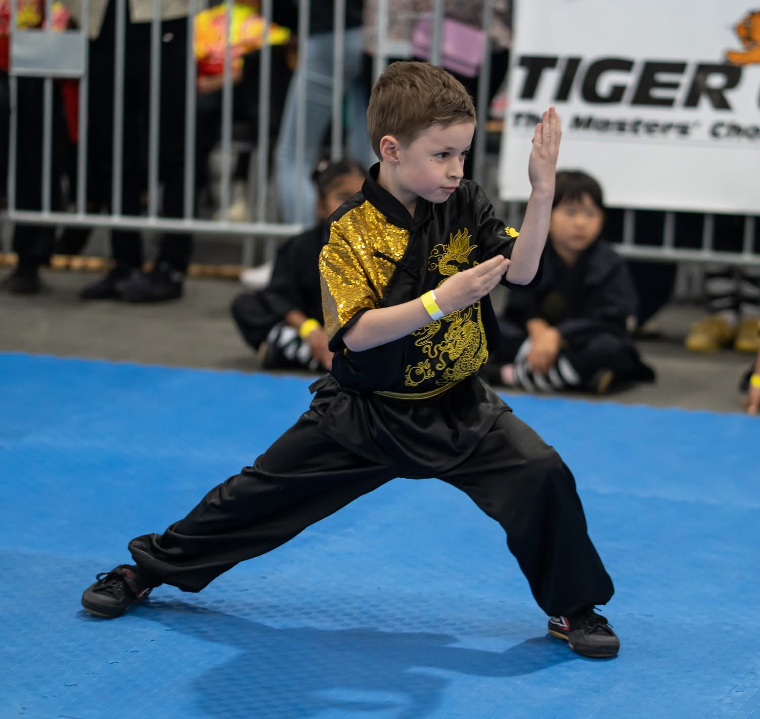Young student performing form at Tiger Claw competition