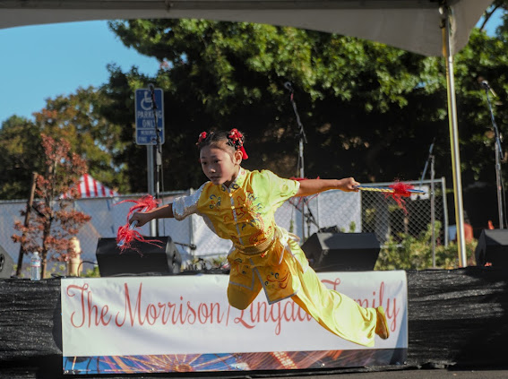 Student performing at outdoor festival stage