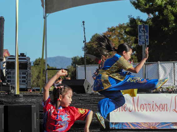 Two students performing at outdoor Bay Area festival